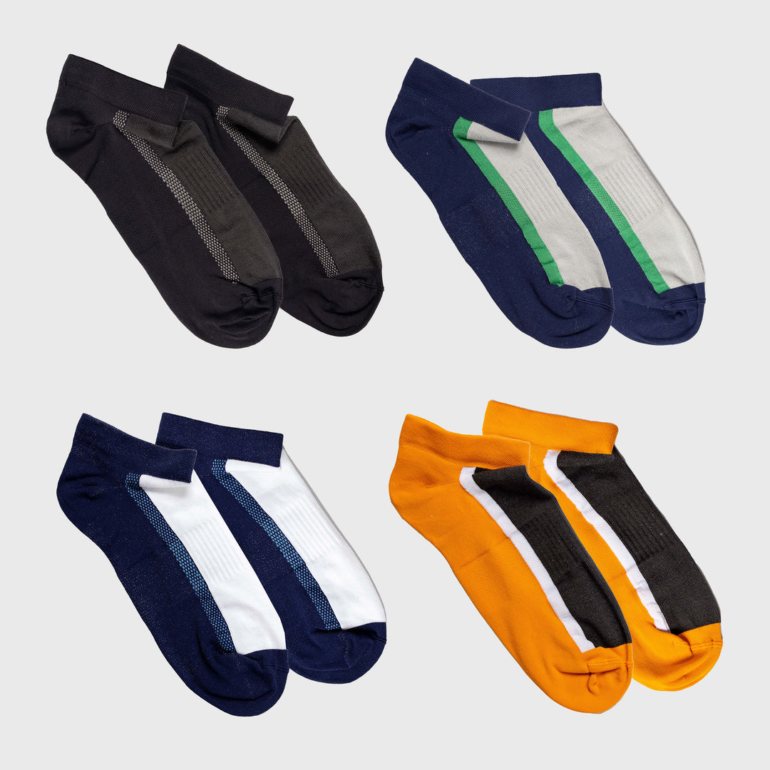 Four pairs of ankle socks are arranged in a grid: black with gray detailing, navy blue with white and green accents, navy blue with white accents, and orange with black and white accents on a light background.