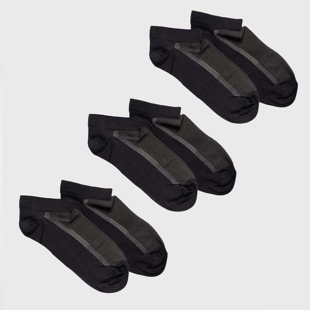 Three pairs of black and dark gray ankle socks with a gray vertical stripe detail, neatly arranged on a light gray background.
