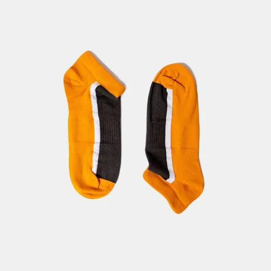 A pair of ankle socks with orange heels and toes, a black center section, and a white stripe running vertically along each sock, displayed on a light gray background.