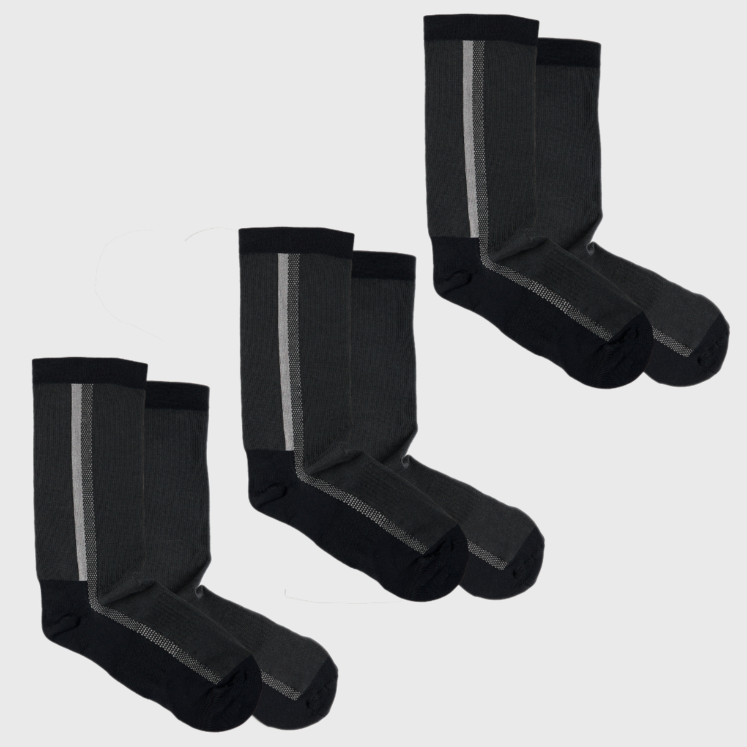 Four pairs of black and dark gray socks with a contrasting vertical stripe on each pair, arranged in two rows on a plain light background.
