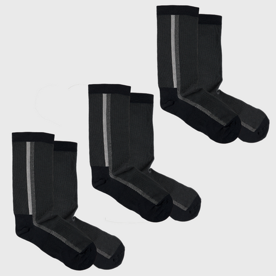 Four pairs of black and dark gray socks with a contrasting vertical stripe on each pair, arranged in two rows on a plain light background.
