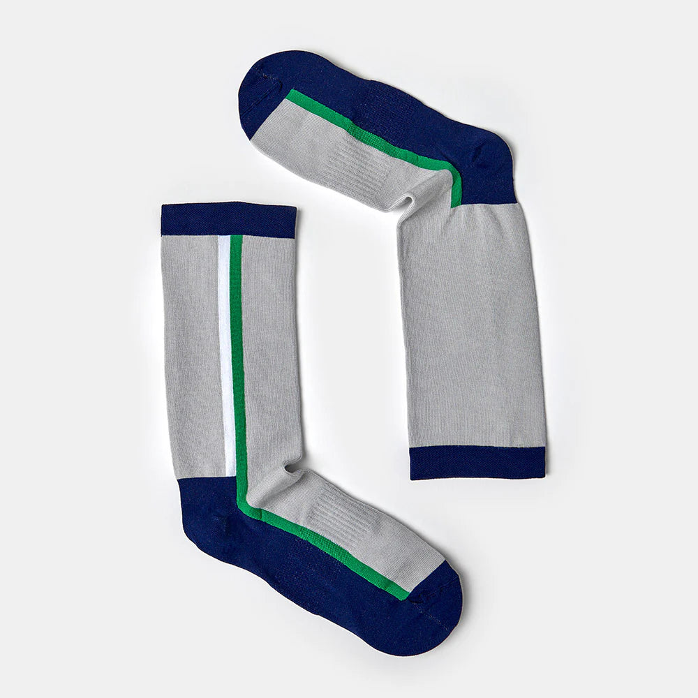 A pair of light gray socks with dark blue toes, heels, and cuffs, and a green and blue vertical stripe running along the sides, arranged on a plain white background.