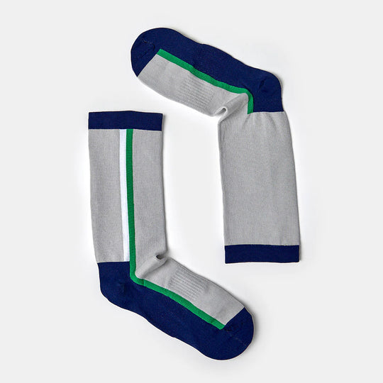 A pair of light gray socks with dark blue toes, heels, and cuffs, and a green and blue vertical stripe running along the sides, arranged on a plain white background.